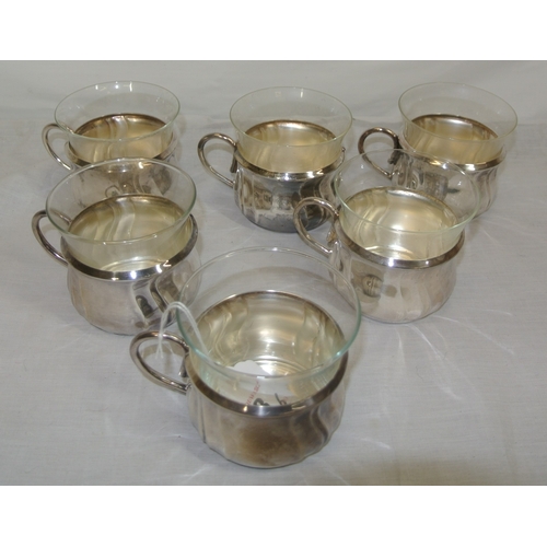 11 - Set of 6 Continental silverplated tea cup holders with shaped handles