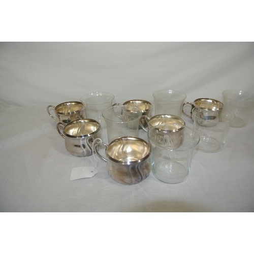 11 - Set of 6 Continental silverplated tea cup holders with shaped handles