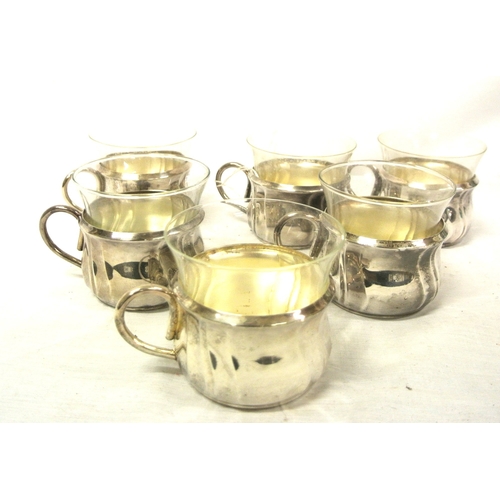 11 - Set of 6 Continental silverplated tea cup holders with shaped handles