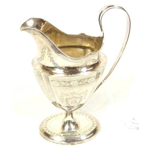 149 - Irish silver helmet shaped cream jug of oval tapering form with concave corners, shaped handle, with... 