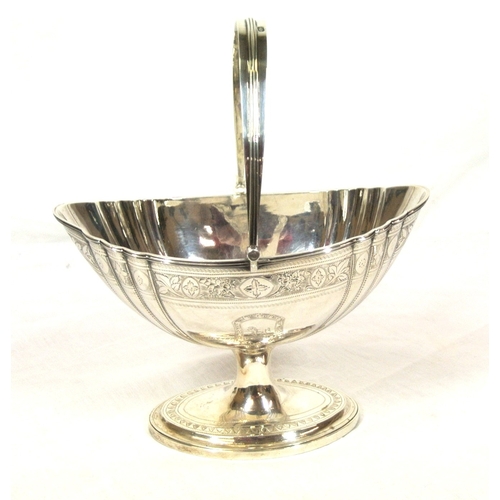 150 - Irish silver swing handled sugar basket with reeded swing handle, reeded rim, foliate decoration and... 