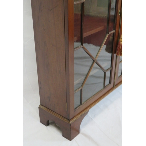 295 - Edwardian mahogany bookcase with astragal glazed doors, shelved interior, dentil frieze, on bracket ... 