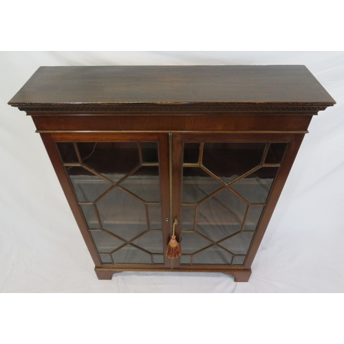 295 - Edwardian mahogany bookcase with astragal glazed doors, shelved interior, dentil frieze, on bracket ... 