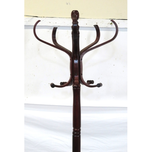 299 - Mahogany standard coat & hat rack with S-shaped hangers & shaped base