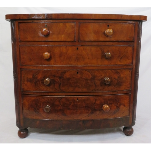 305 - Victorian mahogany & walnut bow fronted chest of 2 short & 3 long drawers with bun handles, on ball ... 