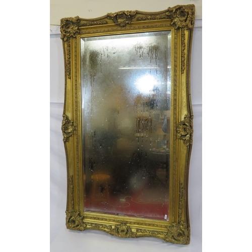 306 - Large Regency design gilt framed bevelled wall mirror with ornate foliate & scroll decoration