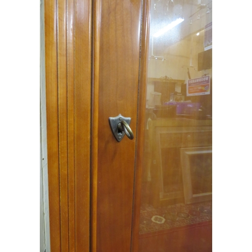 320 - Walnut cased display cabinet with glazed doors & shelving, on bracket feet