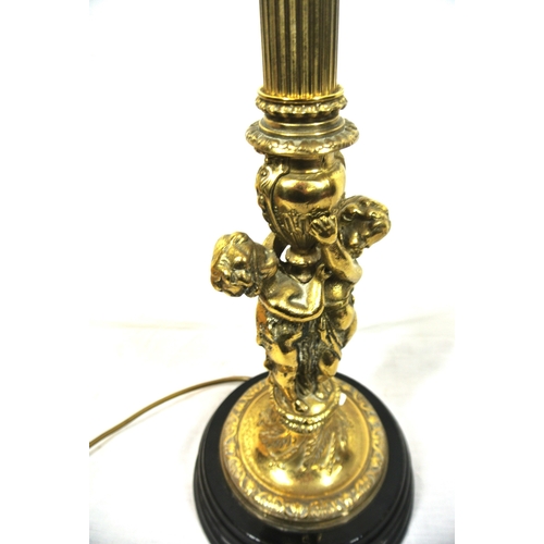 322 - Ornate brass electric table lamp with reeded & figured foliate decorated column, on round stepped ba... 