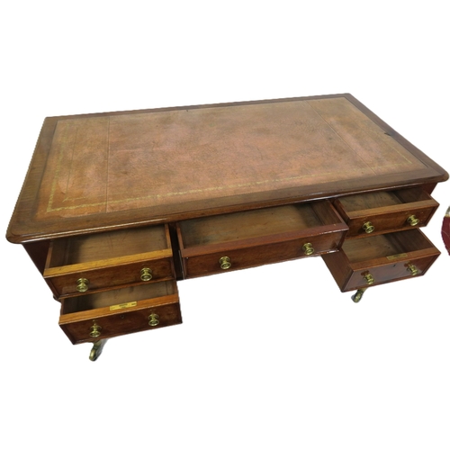 345 - Edwardian walnut & mahogany desk with leatherette inset, 5 drawers with brass handles, on turned ree... 