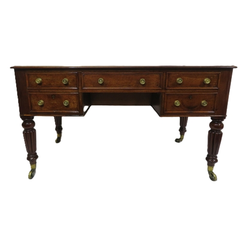 345 - Edwardian walnut & mahogany desk with leatherette inset, 5 drawers with brass handles, on turned ree... 