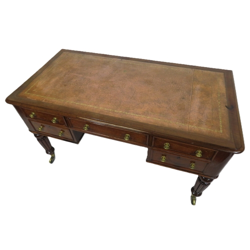 345 - Edwardian walnut & mahogany desk with leatherette inset, 5 drawers with brass handles, on turned ree... 