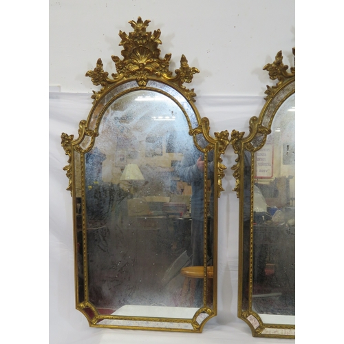 397 - Pair of ornate French style domed framed wall  mirrors with ornate shell & foliate decoration