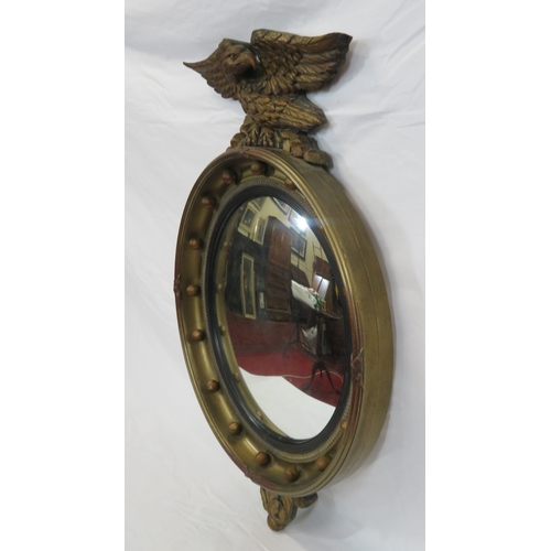 398 - Regency style convex mirror with eagle surmount & ball decoration