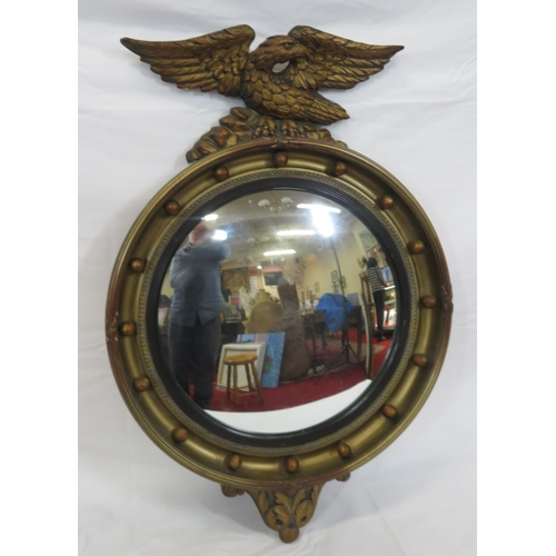 398 - Regency style convex mirror with eagle surmount & ball decoration