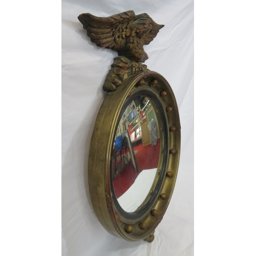 398 - Regency style convex mirror with eagle surmount & ball decoration