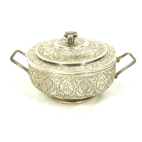 65 - Persian silver round bowl with cover and shaped handles, ornately decorated. 289g, 11.5cm diam