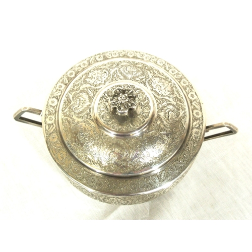 65 - Persian silver round bowl with cover and shaped handles, ornately decorated. 289g, 11.5cm diam