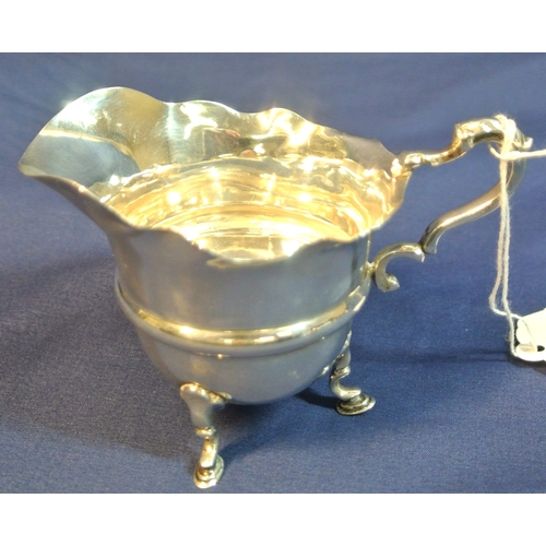 66 - 2 English silver creamers with wavy rims and shaped handles, Chester & Birmingham, total weight 123g