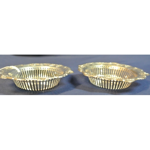 69 - Pair of Birmingham silver round bon-bon dishes with decorated rims and pierced bodies, d10.5cm, 55g