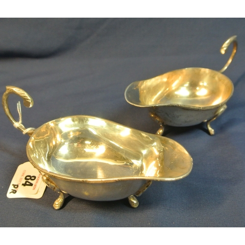 84 - Pair of boat shaped silver plated sauceboats with Celtic design rims, S-scroll handles and hoof feet