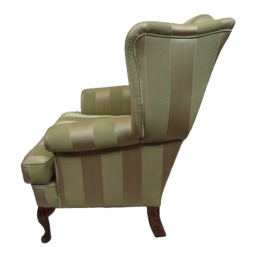 477 - Edwardian style wingback armchair with striped upholstery, on cabriole legs with pad feet