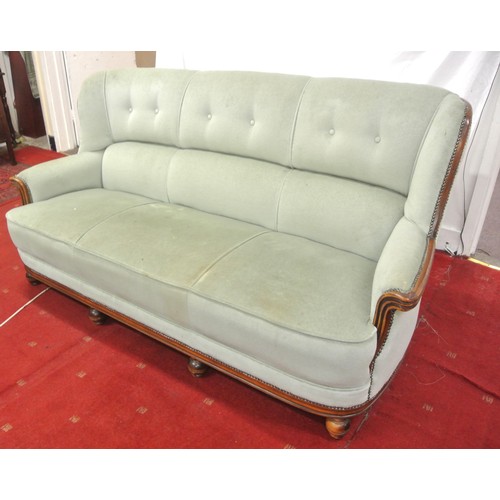 471 - Walnut framed 3 seater couch with buttoned upholstery, shaped arms, on ball feet