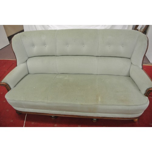 471 - Walnut framed 3 seater couch with buttoned upholstery, shaped arms, on ball feet