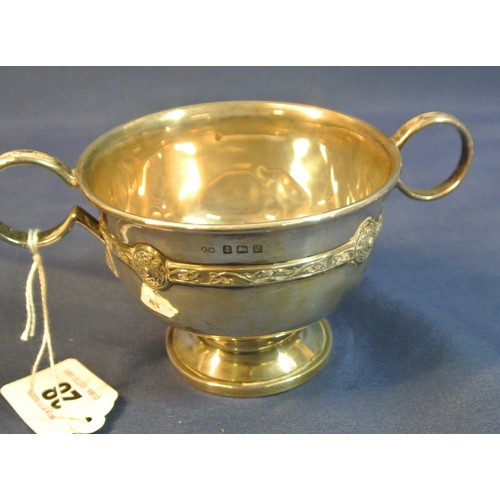 28 - Birmingham silver round vase with Celtic banding and shaped handles or round spreading base