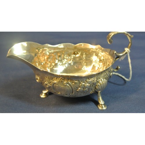 129 - Irish Provincial silver small sauceboat, ornately chased and embossed with scrolls and foliage, with... 