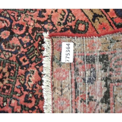 272 - Washed red ground full pile Iranian village runner. 310 x102cm