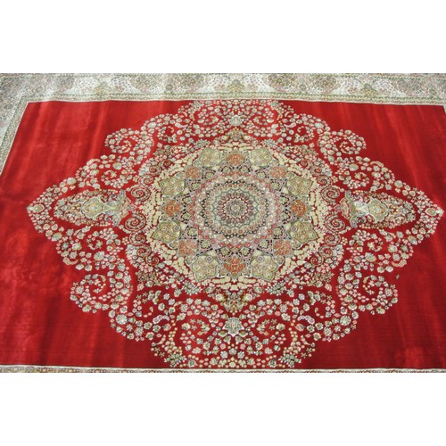 312 - Full pile fine woven red ground bamboo silk carpet with traditional floral design. 230 x 160 cm