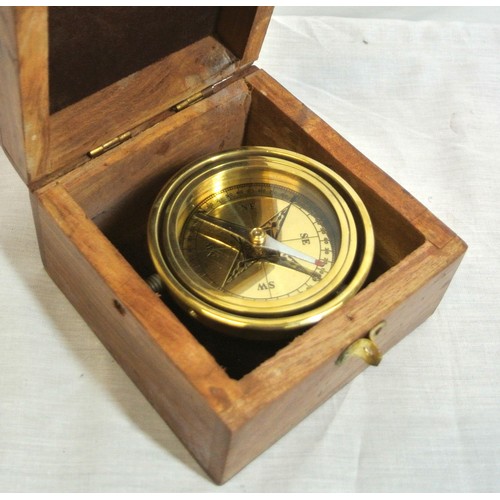 348 - Mariners round brass gimballed compass in teak case