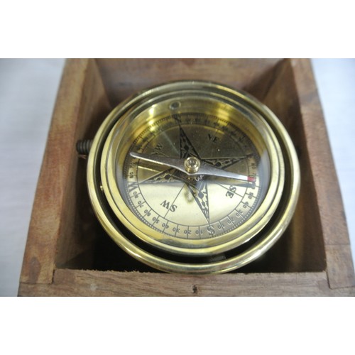 348 - Mariners round brass gimballed compass in teak case