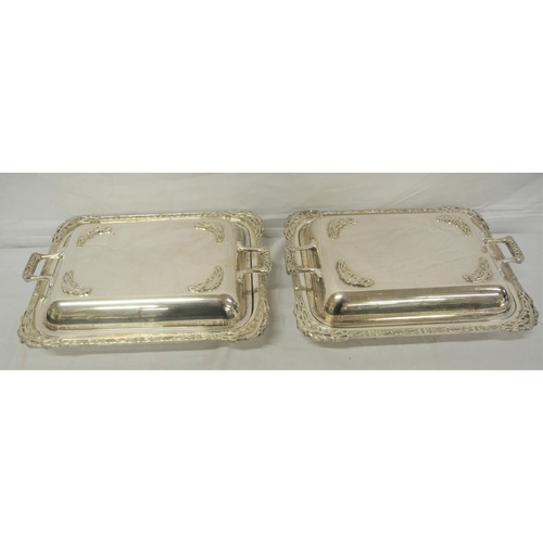 12 - Pair of silver plated entree dishes with shaped handles and Celtic decoration