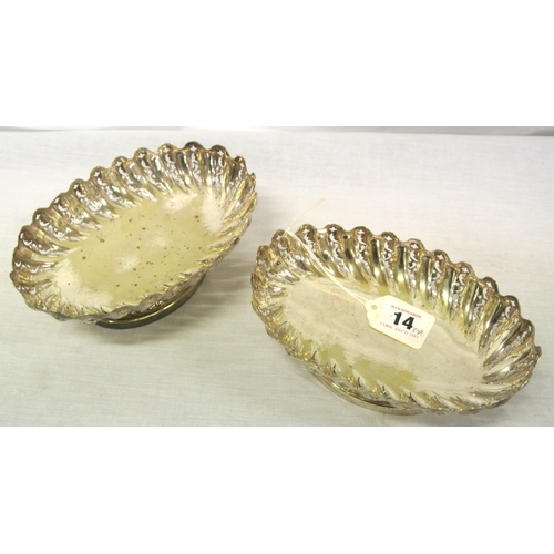 14 - Pair of oval silver plated bread or sweet dishes with pierced reeded sides, wavy rims, on oval sprea... 