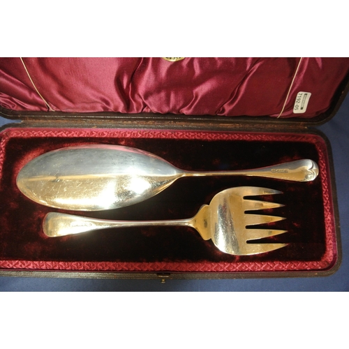 19 - Pair of silverplated fish servers, ornately decorated, in presentation case