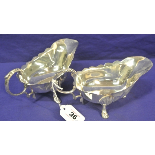 36 - Pair of silver plated sauceboats with wavy rims, scroll handles, on hoof feet