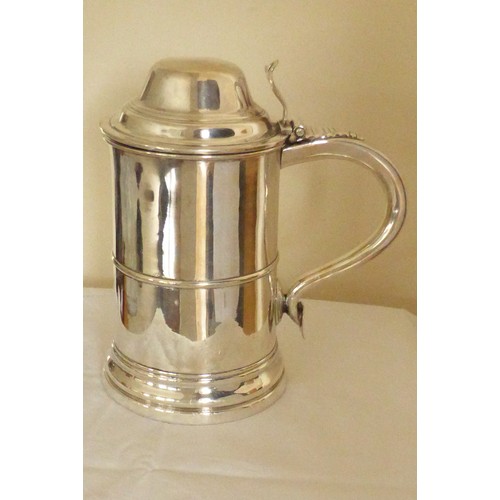 45 - Silver plated round tankard with thumbpiece and shaped handle