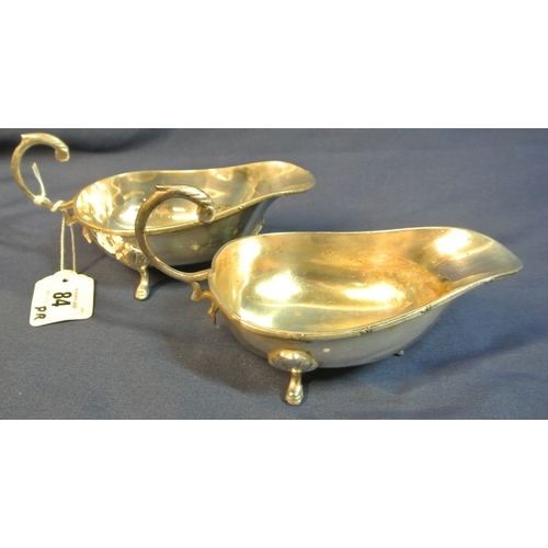 84 - Pair of boat shaped silver plated sauceboats with Celtic design rims, S-scroll handles and hoof feet