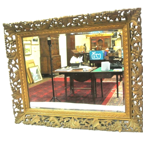 332 - Victorian style timber wall mirror with ornate foliate & grapevine carved frame