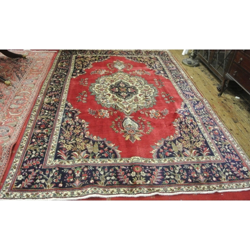 444 - Blue and red ground Persian Tabriz carpet with traditional medallion design. 290x 200cm