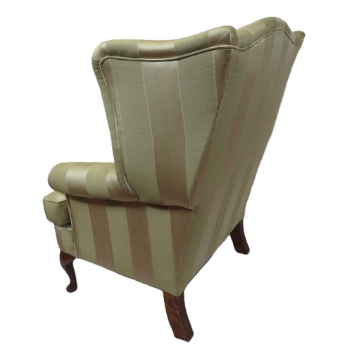 477 - Edwardian style wingback armchair with striped upholstery, on cabriole legs with pad feet