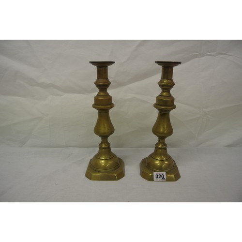 320 - Pair of brass candlesticks with stepped bases