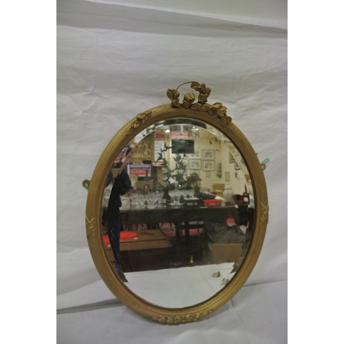 386 - Oval gilt framed bevelled glass mirror