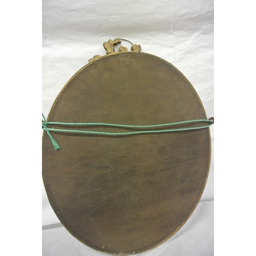 386 - Oval gilt framed bevelled glass mirror