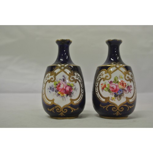 367 - Pair of Royal Crown Derby baluster shaped bud bases with deep blue glaze with gilt and foliate hand ... 