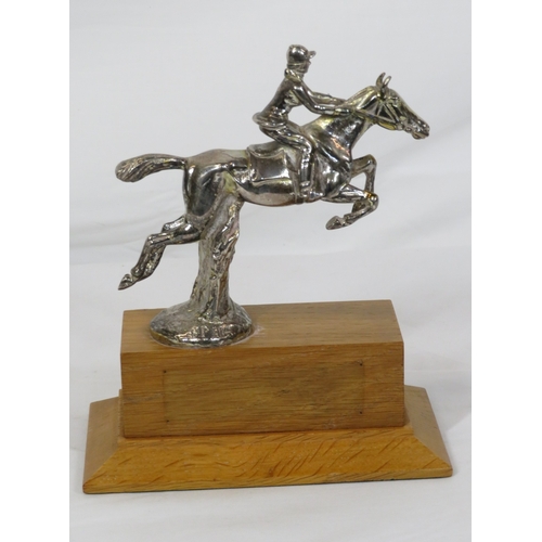 226 - Chrome ornament of a rider & show jumper on raised timber base