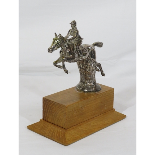 226 - Chrome ornament of a rider & show jumper on raised timber base