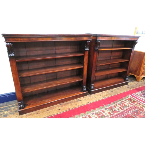 245 - Pair of Edwardian rosewood open bookshelves with scroll decoration, adjustable shelving, on oblong p... 