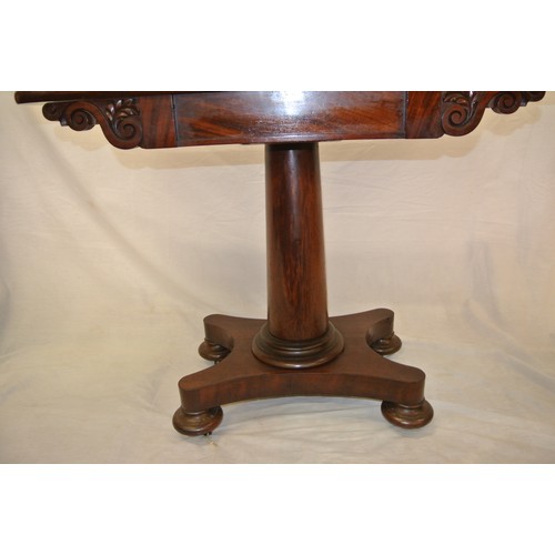 200 - William IV mahogany tea table with swivel fold-over top, scroll frieze, turned tapering column with ... 